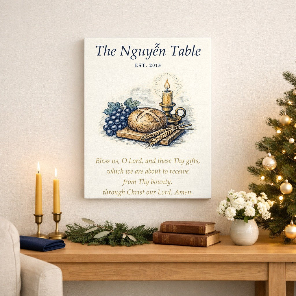 Grace before meals canvas with bread, grapes, wheat and a candle, a sample family name and the prayer Bless us, O Lord, on a living room wall