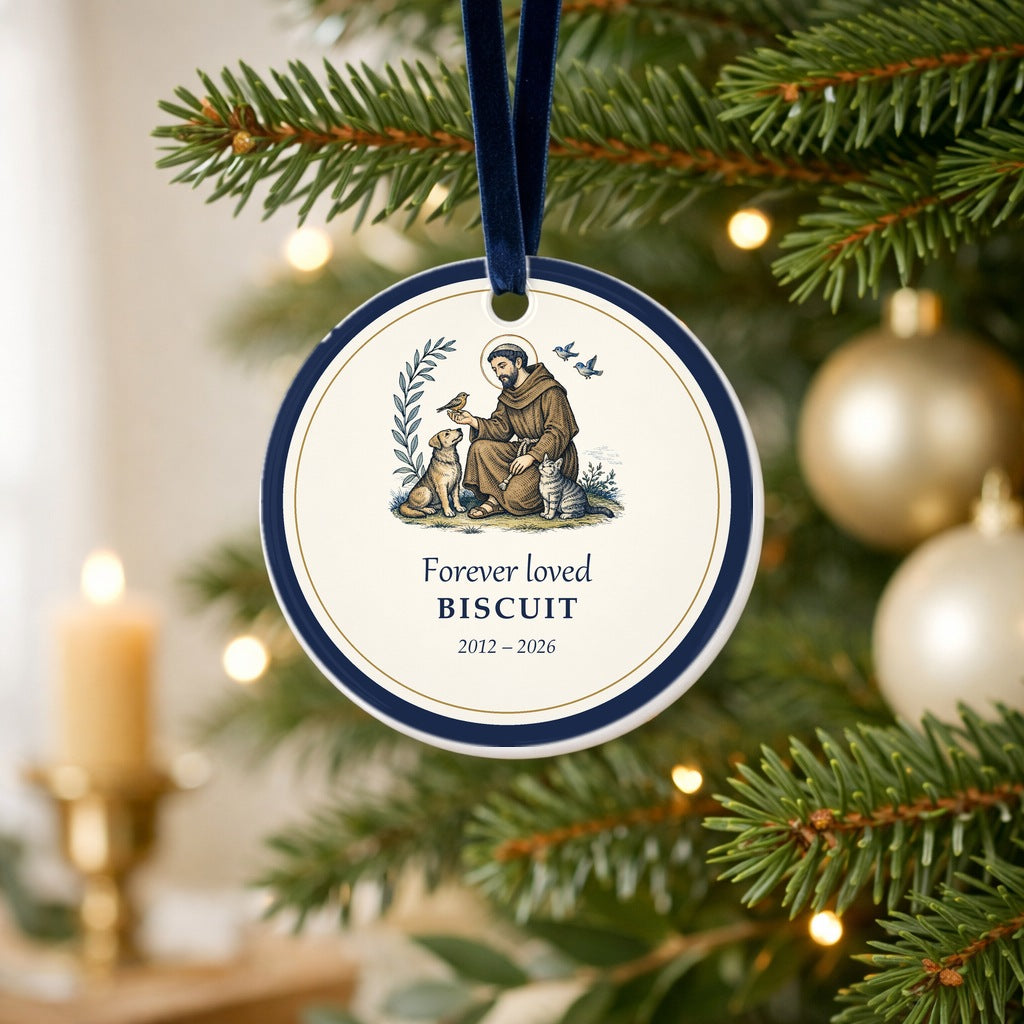Personalized St. Francis of Assisi pet memorial ornament with dog, cat and bird hanging on a Christmas tree